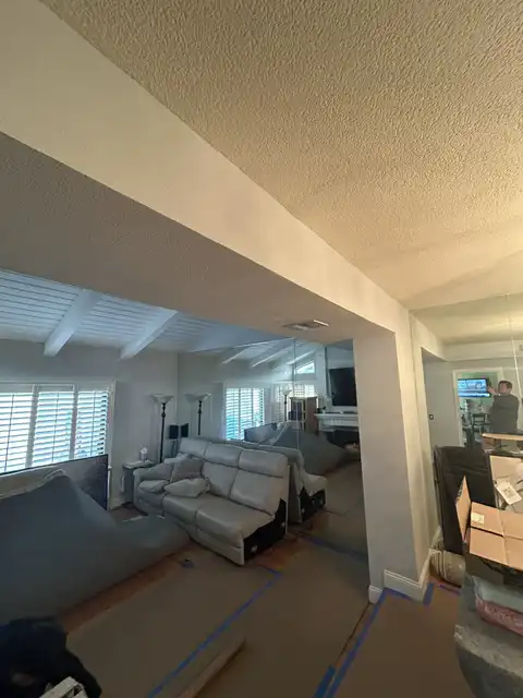 Small soffit water damage repair. Finish items protection, Demolition, drywall hanging, taping, corners application, matching existing texture and clean up. 2026 project photo